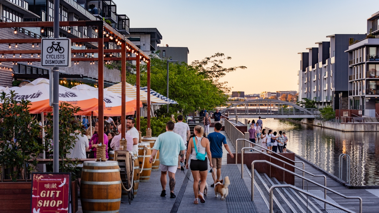 A busy promenade by the water.